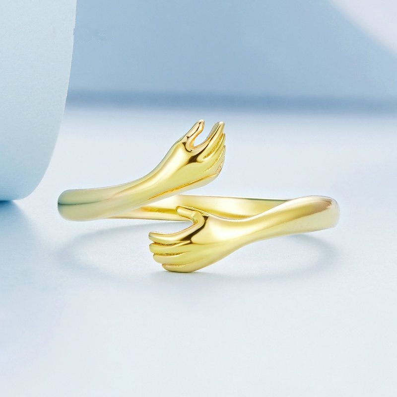 Gold plated ring with hand shape